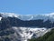 Incredible snowy mountain surrounded by trees and forest in Argentina.