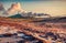 Incredible summer view of Reykjanes Lighthouse with steam from a Gunnuhver Hot Springs.