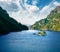 Incredible summer view with small island with typical Norwegian building on Lovrafjorden fjord, North sea. Colorful morning view i