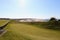 An incredible view of a golf hole in Scotland with the ocean in the background