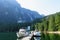 An incredible view of princess louisa inlet and chatterbox falls from the dock with boats tied up, in British Columbia, Canada.