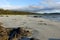 An incredible view of the sandy beaches of nels bight, surrounded by forest and the pacific ocean, along the beautiful cape scott