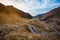 Incredible view of an unique road in the mountains at more than 2000m high. Cars passing. One of the most known roads in Romania,