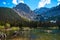 Incredibly beautiful transparent, emerald calm lake with reflection of rocky mountain on the Black Prince Cirque Trail. Majestic