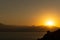 Incredibly landscape of the setting sun against the backdrop of mountains