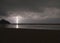 Incredibly sharp lightning with branches hitting the ocean with