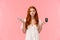 Indecisive and unsure cute european redhead woman shrugging, looking confused and useless camera, shrugging with