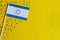 Independence Day of Israel. Flag of Israel on a festive yellow background. The concept of celebration, patriotism and celebration