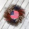 Independence Day wreath with flag on rustic white wooden boards