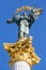 Independence monument in Kiev, Ukraine. This is a statue of an angel, made of copper, and gold plated, standing on a tall pillar,