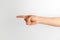 Index finger hand signal on white background