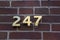 Index with the number 247 on the facade