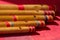 India, Comparison of different sizes of hindu bamboo flute called Bansuri on a red table.