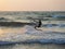 India, Goa, Arambol, a man kitesurfing near the coast