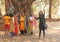 India, GOA, January 18, 2018. A group of Indian girls on a background of a large sacred banyan tree makes a selfie. Selfish on a