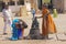 India, Hampi, 01 February 2018. Indian women posing next to a figure or statue of a connected cow