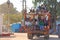 India, Hampi, 02 February 2018. A beautiful Indian truck carries a lot of Indian people. The merry Hindus smile and wave their