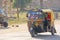 India, Hampi, 02 February 2018.The main street of the village of Hampi - motokrisha carries the tourists