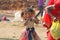 India, Hampi, 02 February 2018. A small poor and dirty Indian girl playing with sunglasses. A little girl in big glasses from the