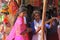 India, Hampi, 02 February 2018. Young girls in bright pink saris are buying something on the market