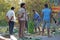 India, Hampi, January 31, 2018. Men are loading large green banana branches into the truck