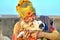 India Madyha Pradesh Orchha. Portrait of a holy man (sadhu) with his puppy dog
