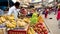 India, Varanasi, India, Mar 10, 2019 - Vendors selling fresh fruits, banana, apples, grapes at old market in Varanasi