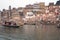 India, Varanasi - November 2009:A view of holy ghats of Varanasi with a boatman sailing