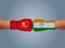 India vs China concept. India and china fight hand boxing gloves concept. India and china fight or war on border background.