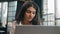 Indian anxious woman with computer working business problem in office Arabian dissatisfied girl worker upset confused