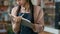 Indian arabian female staff waitress writing in notebook taking customer order in cafe woman catering employee worker