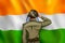 Indian Army soilder saluting falg of India with pride