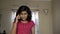 Indian Asian caucasian angry upset annoyed girl child scolding someone on mobile phone call front view portrait angry expression.