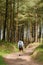 Indian Asian woman hiking in Gower Peninsula, Wales, UK