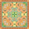 Indian bandana print in green and orange tones with paisley and flowers