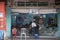 Indian barber cleaning the shop before open