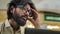 Indian bearded stressed man in glasses working at office with laptop Arabian businessman sad with business problem