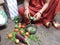 Indian Beautiful Village Women Cutting Vegetable in her Kitchen .