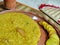 Indian bengali food khichuri or khichdi served on terracotta clay plate