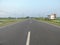 Indian bengali pitch road both side green nature beauti rightside bachan sing dhaba