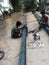 Indian boy doing some work for under ground electricity connection pipe joint