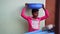An Indian boy wearing pink T shirt, active on labor working. Little kid with the blue sand tub