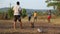 Indian boys playing cricket at the playing field in Goa.