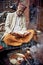 Indian Brahmin sits near the temple of Lord Krishna