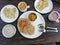 Indian breakfast - bread, spices, omlet, masala tea, corn flakes with milk