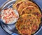 Indian breakfast koki flatbread with raita yogurt dip