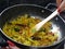 Indian breakfast Poha topped with peanuts, pomegranate seeds, chopped green chilly