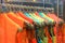 Indian bridal ethnic wear kurta hanging from hangar at a shop for sale behind glass