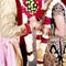 Indian bride & Groom holding hands wedding portrait