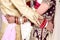 Indian bride and groom pose for beautiful portraits after their colorful jaimala ceremony